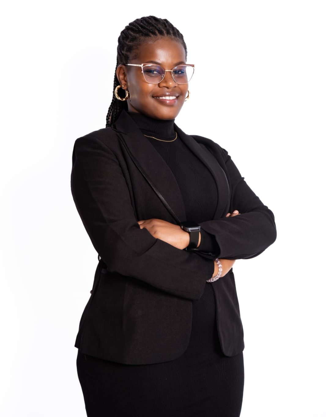 Portrait of Janet Wanjiku, clinical psychologist, standing confidently in professional attire